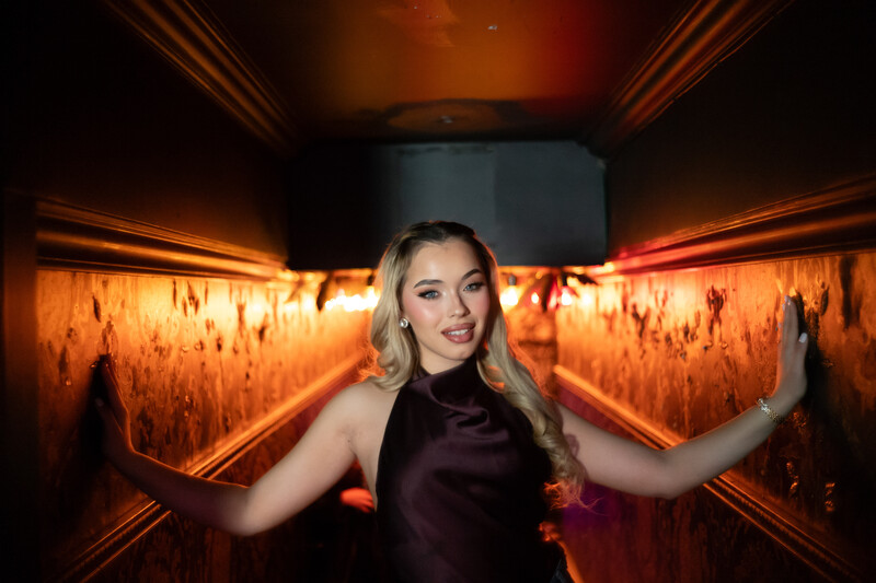 Model standing in a hallway