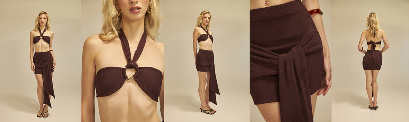 Model wearing brown halter bikini top and coordinating wrap skirt in studio setting.