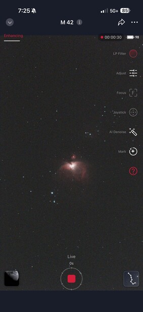 Screenshot of a mobile stargazing app displaying a deep-space object with dim stars visible against a dark background.