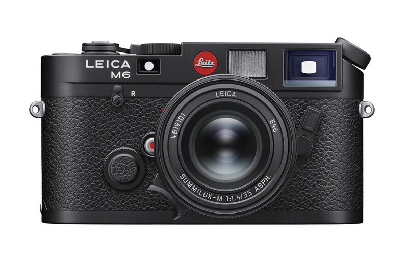 Leica M6 rangefinder camera with textured black body and 50mm lens, shown from front against white background.