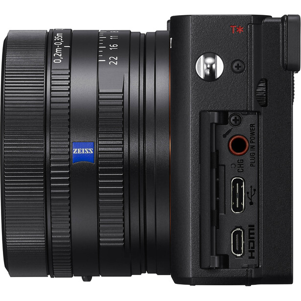Sony mirrorless camera with Zeiss lens attached, shown from side angle displaying right panel controls.