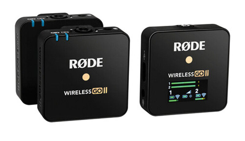 RODE Wireless GO II microphone system with two black transmitter units and one receiver unit displaying LED indicators.