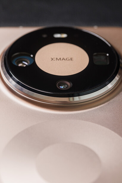 X-IMAGE lens cap or protective cover with black exterior and center label on white surface.