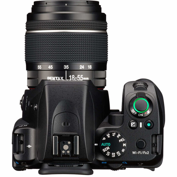 Top-down view of a DSLR camera with an 18-55mm lens and built-in flash.