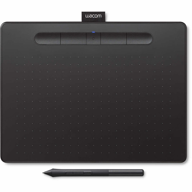 Wacom graphics tablet with stylus pen on dark surface.