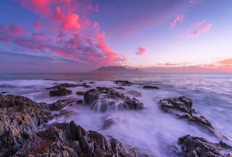 A sunset at Bloubergstrand in Cape Town. Table Mountain is in the background