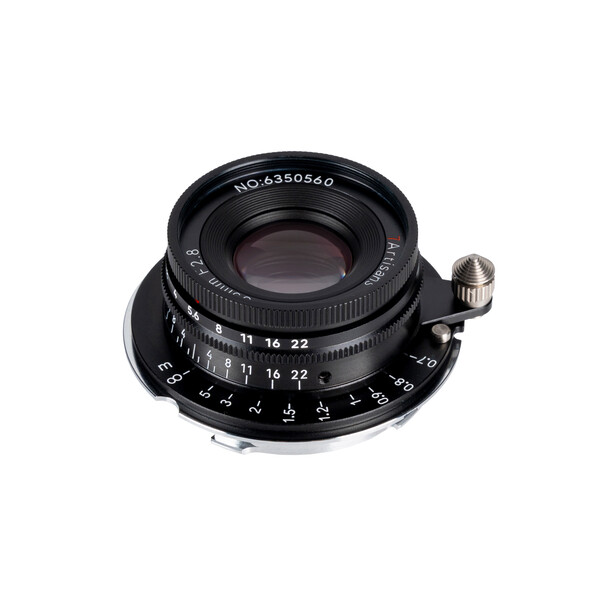 Vintage rangefinder lens with black barrel and distance scale markings positioned at angle.