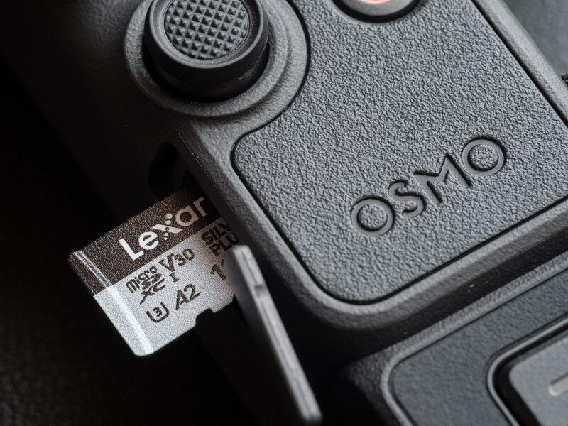 Lexar microSD card inserted into DJI Osmo gimbal stabilizer device.