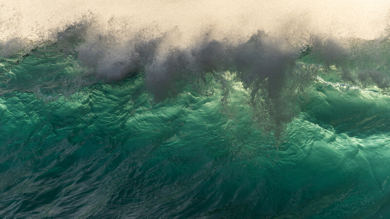 Back lit waves breaking 