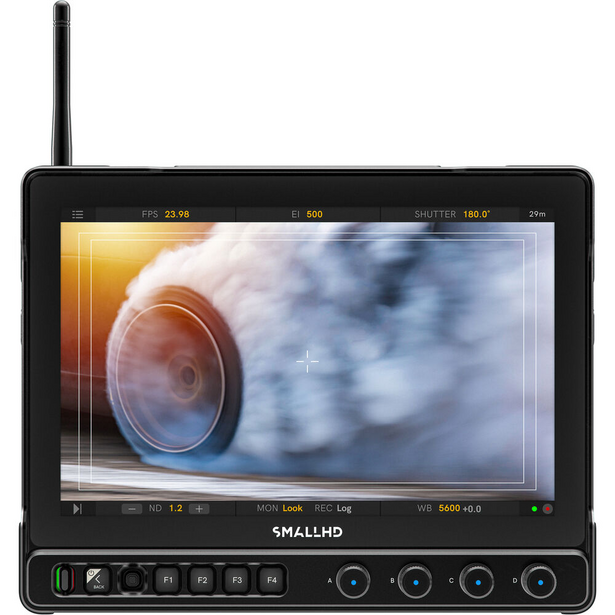 SmallHD production monitor displaying motion-blurred automotive wheel and sky