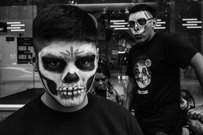 Person with skull face paint makeup in black and white portrait