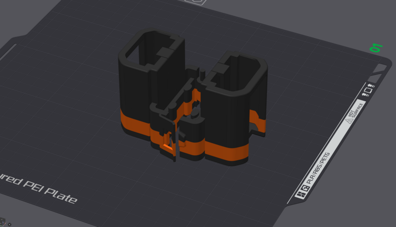 3D rendered illustration of a black and orange modular electronic component or connector assembly