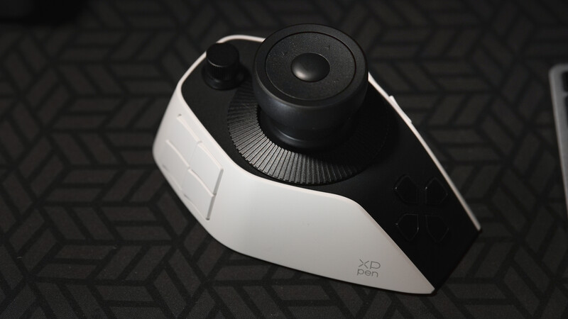 White and black VR headset viewed from above on a geometric patterned surface