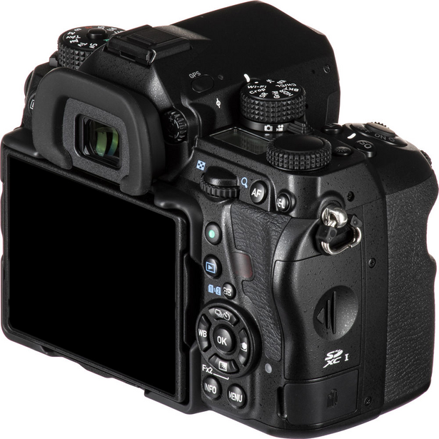 Professional mirrorless camera displayed from rear angle showing LCD screen and control buttons