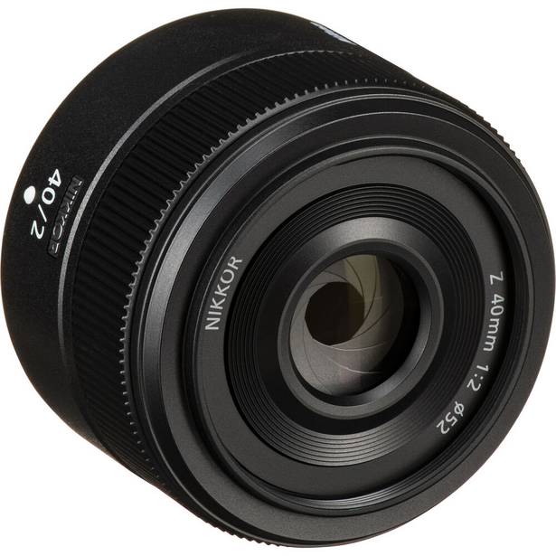 Nikon Z 24mm f/2.8 macro lens shown from front angle against white background