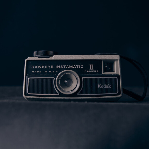Kodak Hawkeye Instamatic II vintage film camera on dark surface