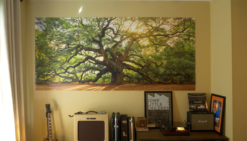 Large canvas print of a sprawling oak tree with golden sunlight filtering through dense foliage