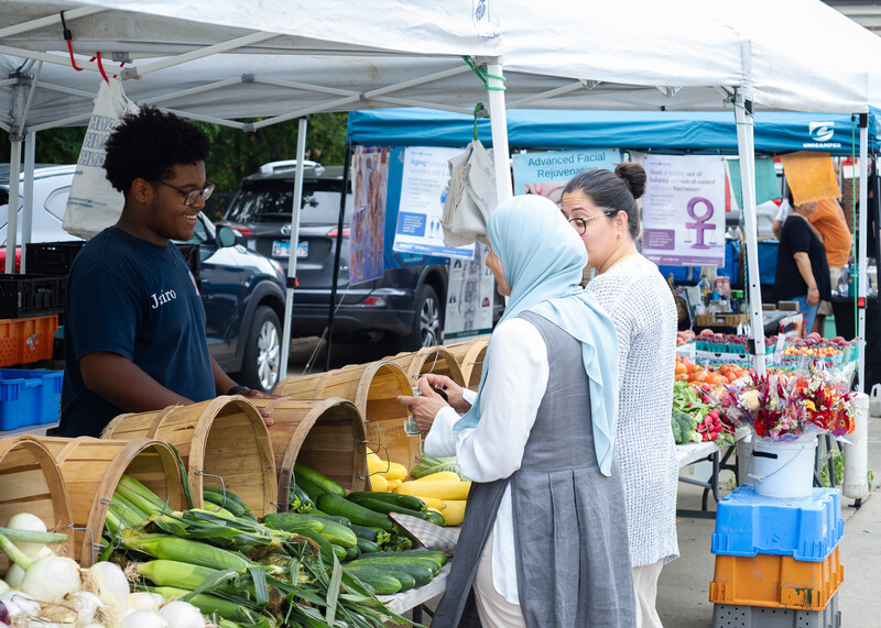A color street photograph from a farmers market