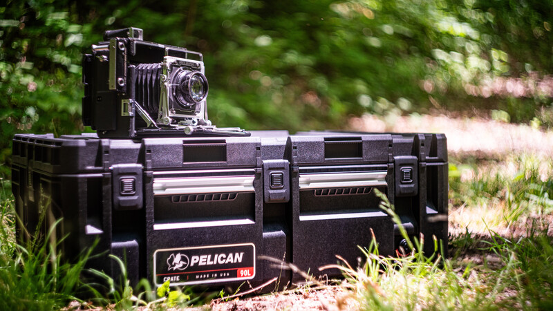 Large format camera mounted on Pelican case in outdoor setting