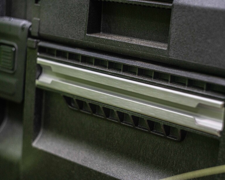 Close-up of a camera's film advance mechanism and viewfinder