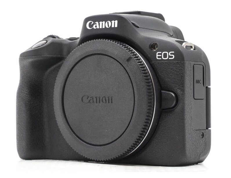 Canon EOS R50 mirrorless camera body shown from front-left angle against white background