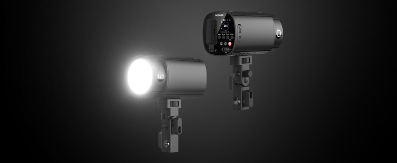 Two studio flash heads mounted on light stands against dark background