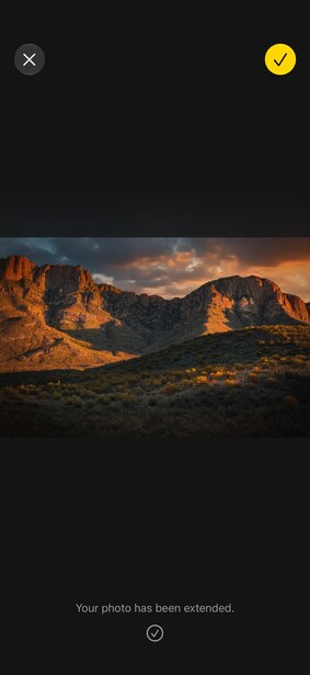 Desert mountain landscape bathed in golden hour sunlight with dramatic clouds overhead