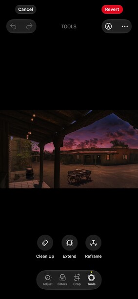 Screenshot of mobile photo editing interface showing nighttime storefront with purple ambient lighting