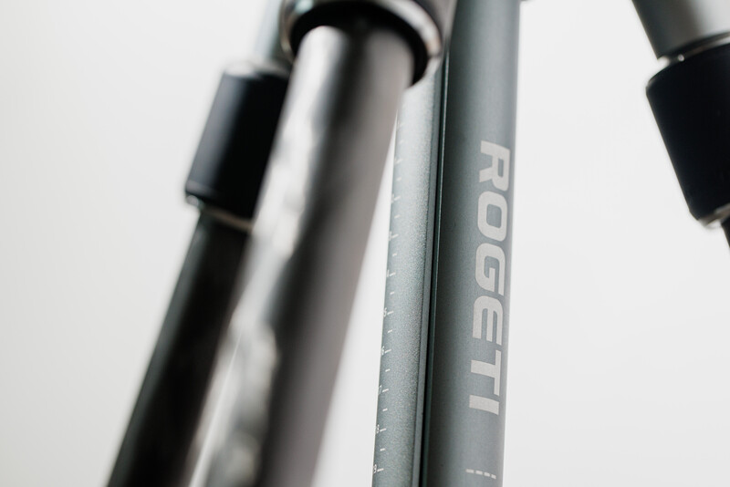 Close-up of a Rogeti tripod leg showing the brand name engraved on the gray metal shaft