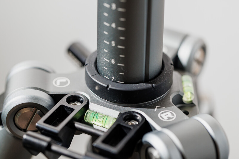 Close-up of camera tripod head with bubble level and mounting plate