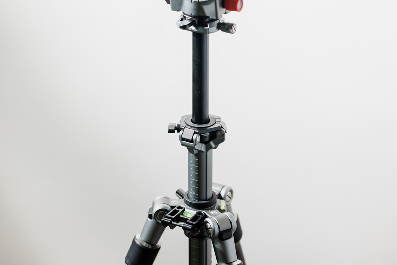 Tripod with ball head and pan-tilt head mount against white background