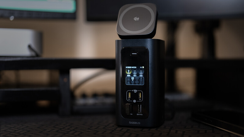 Compact 360-degree camera with modular design showing lens attachments and LCD display