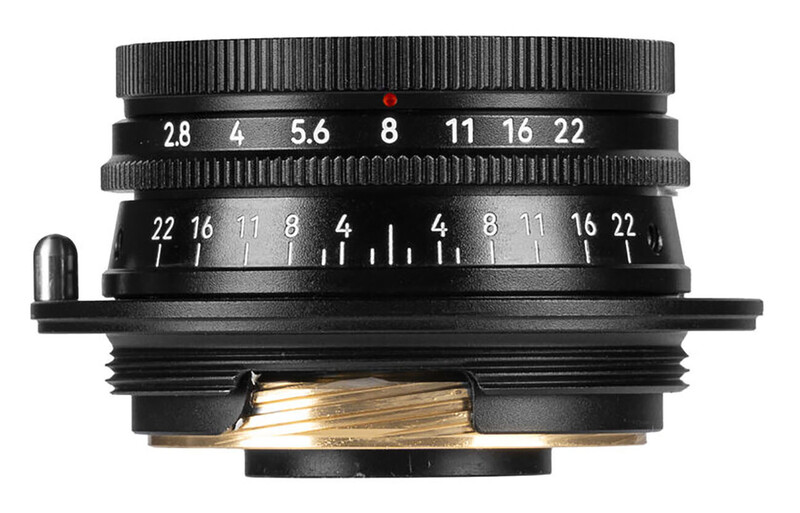 Top-down view of a wide-angle prime lens showing aperture and distance scales