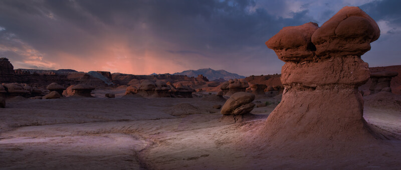 Balanced rock formation at sunset in desert landscape