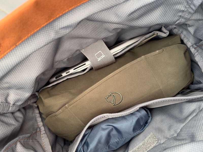 Fjallraven Kanken backpack packed with photography and outdoor gear inside open compartment