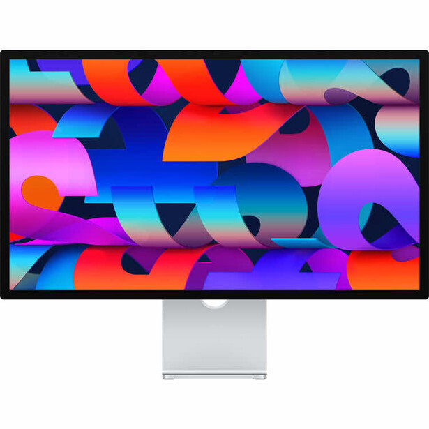 Modern monitor displaying vibrant abstract gradient wallpaper with layered geometric shapes