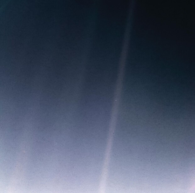 Soft gradient sky transitioning from dark blue to pale lavender with subtle light rays