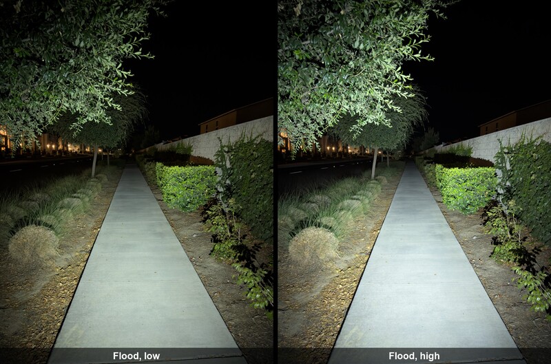 Side-by-side comparison of flood lighting on a nighttime garden pathway at two intensity levels