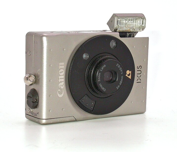 Canon Ixus compact digital camera with built-in flash, silver body with black lens barrel