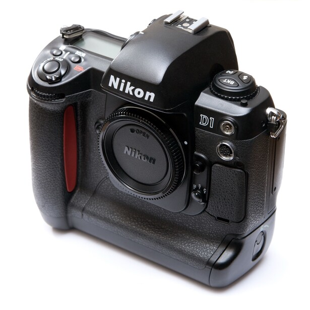 Nikon D1 DSLR camera body with battery grip attached, shown against white background