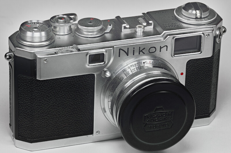 Nikon rangefinder camera with chrome and black body, viewed from front-left angle