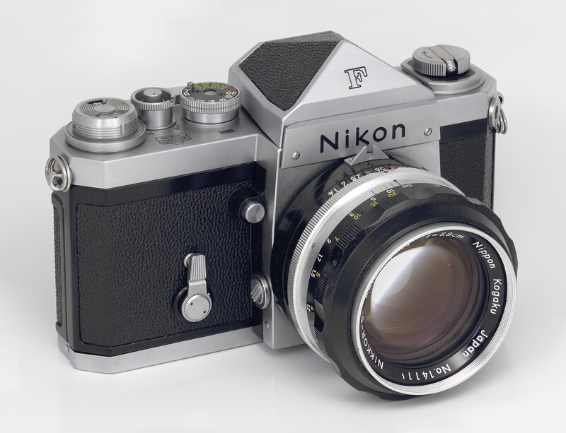 Nikon F vintage film camera with chrome top plate and black leather body, fitted with a Nikkor lens