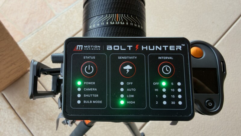 Motion Bolt Hunter camera trap controller mounted on tripod with illuminated control panel