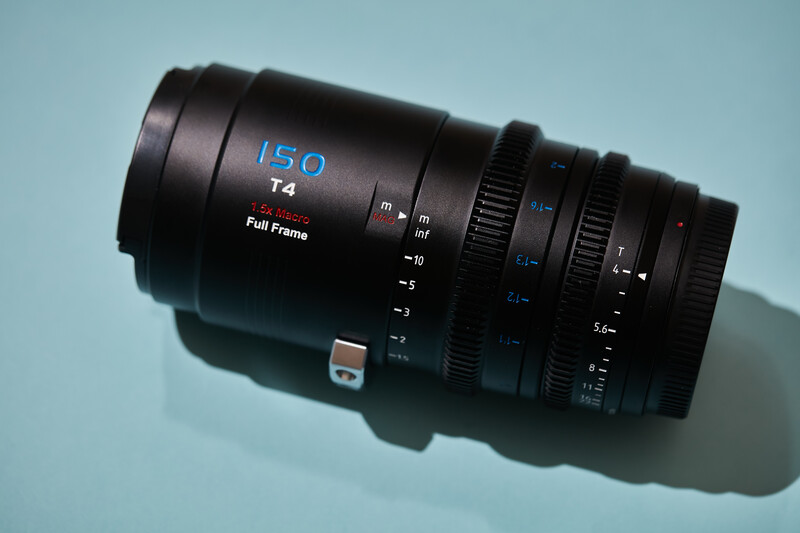 Zeiss 150mm T4 cinema lens on light blue surface with shadow