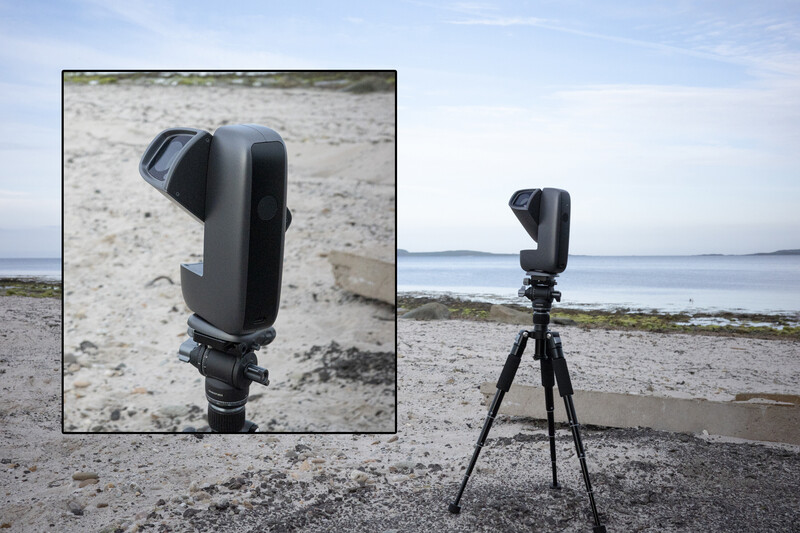 Black telephoto lens mounted on tripod at beach, with inset showing lens detail