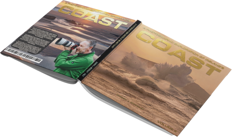Two copies of COAST magazine displayed open, showing landscape photography with golden hour lighting