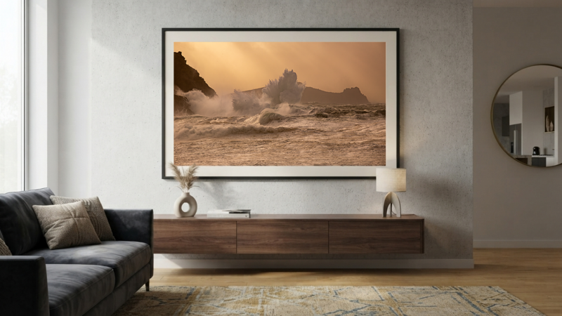 Framed coastal landscape photograph displaying dramatic rocky formations and golden-hour seascape