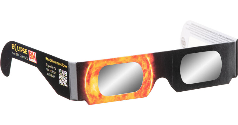 Pair of eclipse glasses with black frames and reflective solar filters showing sun imagery