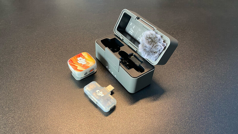 Portable smartphone cinema lens system with protective case and accessories displayed on gray surface