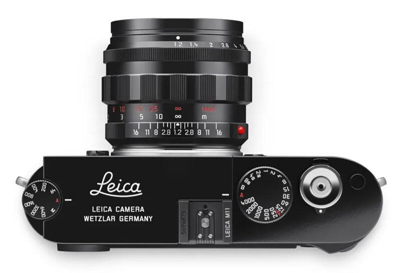 Top-down view of a black Leica rangefinder camera with mounted lens showing aperture scale and focus ring